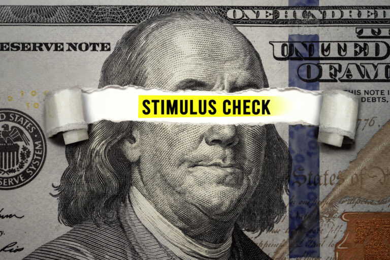 Ben Franklin representing the IRS with eyes scratched out showing Stimulus checks