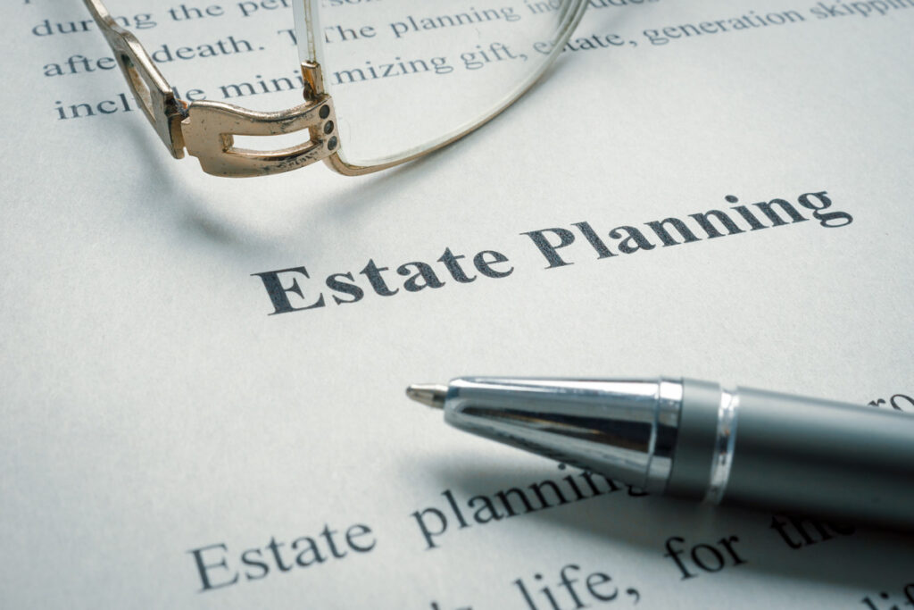 A white piece of paper that reads “Estate Planning” next to a pen in El Paso.